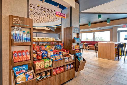 a grocery store with a display of food and drinks at Tru By Hilton Albuquerque North I-25, Nm in Albuquerque