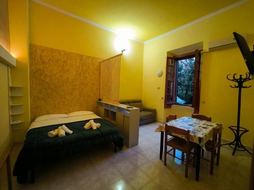 a bedroom with a bed with two stuffed animals on it at Chalet di città in Rome