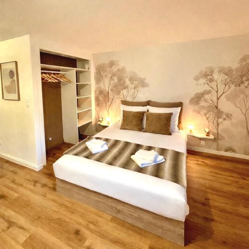 a bedroom with a large bed in a room at FLOK horizon in Malbuisson