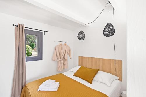 Llit o llits en una habitació de L'Atelier de Maison VB