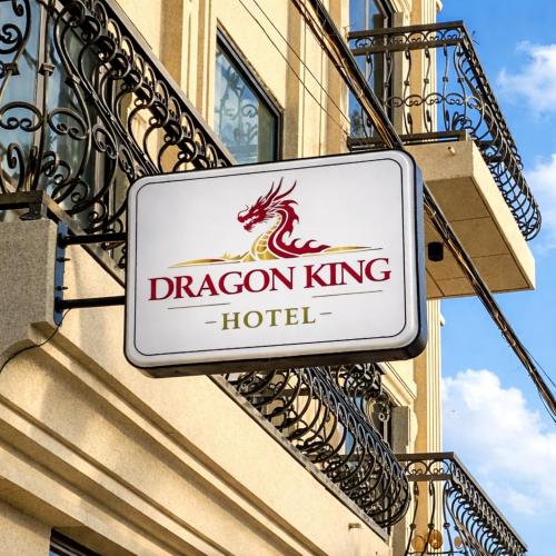 a sign for a dragon king hotel on the side of a building at Dragon King Hotel Nghệ An in Cửa Lô
