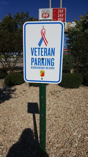 a sign that says veteran parking in a parking lot at Super 8 by Wyndham Temple S General Bruce in Temple