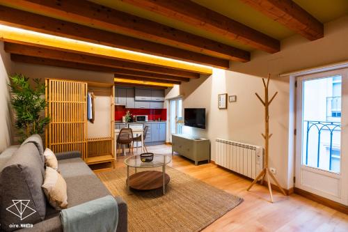 a living room with a couch and a table at EDIFICIO Aire Morito Rozando las Agujas de la Catedral de Burgos in Burgos