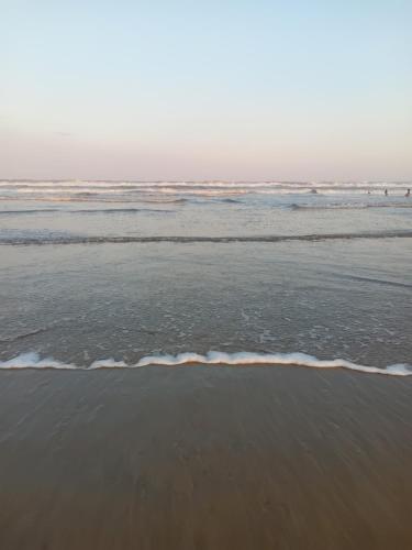 a view of the ocean from the beach at Cabanas Sol e Lua in Imbé