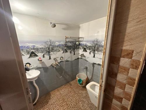 a bathroom with a shower and a sink and a toilet at Jacobs Cottage KG-F2 in Thiruchendur