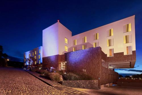 a building at night with its lights on at Albor San Miguel de Allende, Tapestry Collection by Hilton in San Miguel de Allende