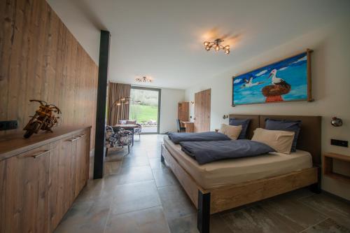 a bedroom with a large bed in a room at Villa Valtin in Le Valtin