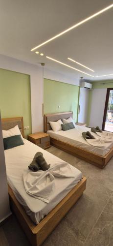 two beds in a room with at Petrino 2 by Vasileia in Sarti