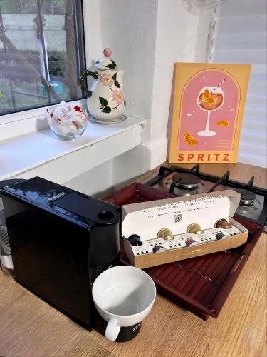a box of chocolates sitting next to a microwave at BraziHouse - pine escape with jacuzzi in Petroşani