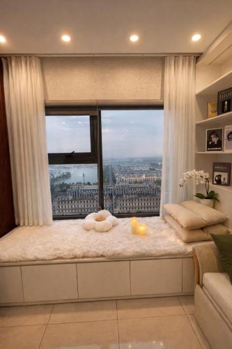 a window seat with a view of the city at Luxury 1BR Apartment - Ocean Lake View - Vinhomes Ocean Park in Gia Lâm Pho