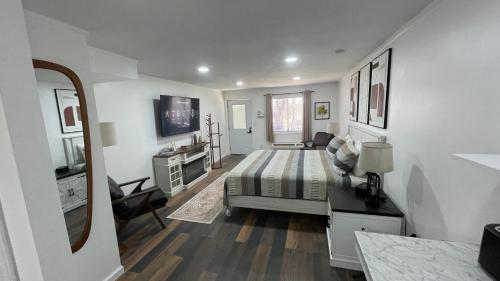 a bedroom with a bed and a desk in a room at Basswood Resort in Platte City
