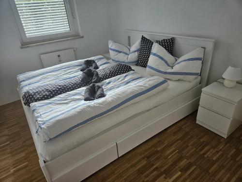 a bed with a teddy bear laying on it at Cozy, new, central in Graz