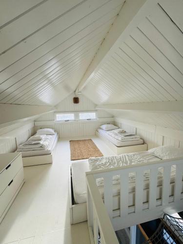 a room with three beds in a attic at SandCsleep in Katwijk