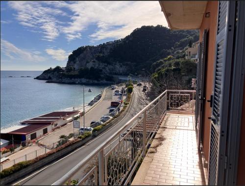 a balcony of a building with a view of the ocean at Verdazzurra in Bergeggi