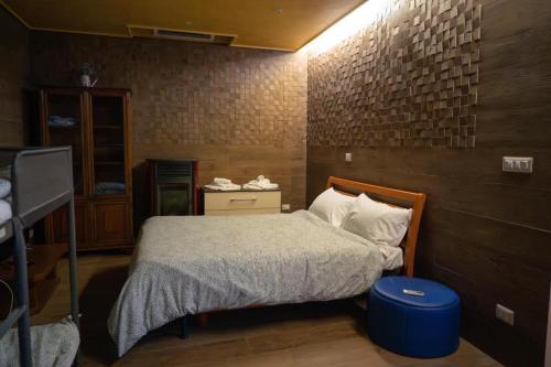 a bedroom with a bed in a room with a brick wall at Le Dimore di Mariuccia 1 in Monte SantʼAngelo