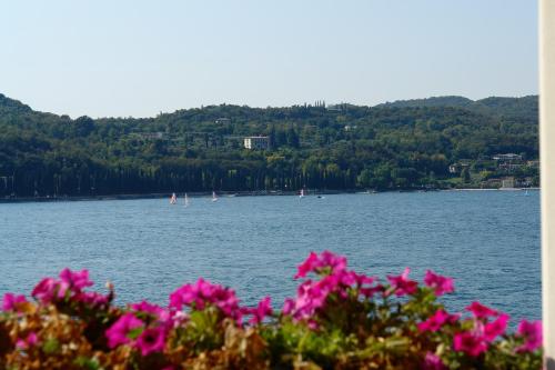 a view of a lake with boats in the water at Hotel Ristorante Lepanto in Salò