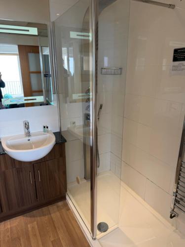 a bathroom with a sink and a shower at Porth Avallen Hotel in St Austell