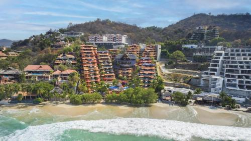 an aerial view of a resort on a beach at Hilton Grand Vacations Club Zihuatanejo in Zihuatanejo