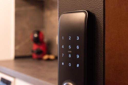 a close up of a remote control on a microwave at Ghetto Experience - Self Check-In - Usa cu Cod in Vaslui