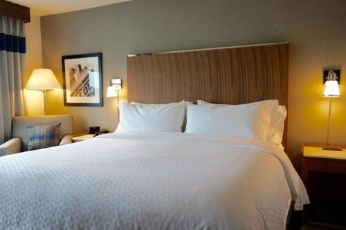 a large white bed in a hotel room at Four Points by Sheraton Midland in Midland