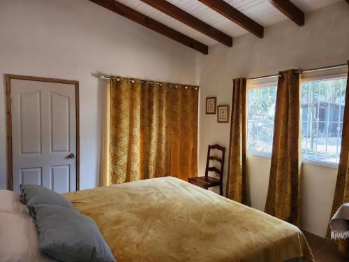 a bedroom with a bed and a window at Casa de Coral in Santa Lucía