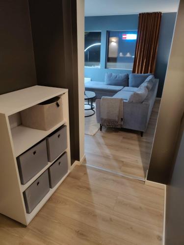 a living room with a couch and a table at Appartement in Harstad 2 in Harstad