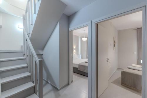 a room with a staircase and a bedroom at Villa Nazar in Xiropigado