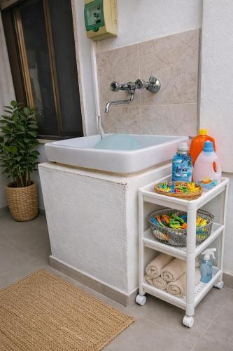 a bathroom with a tub and a sink at leuca bis house in Lecce