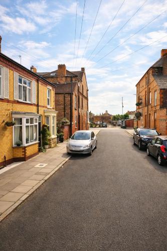 a car parked on the side of a street at EMGS property ltd in Liverpool