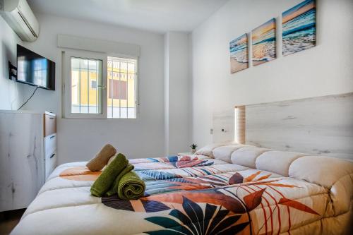 a bedroom with two large beds in a room at Apto Primera Línea con Piscina - Guipas Beach in Puerto de Mazarrón