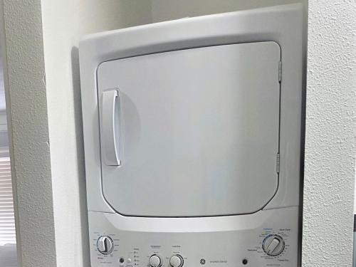 a computer monitor with a mirror on a wall at blue door house grand studio in Lakeland
