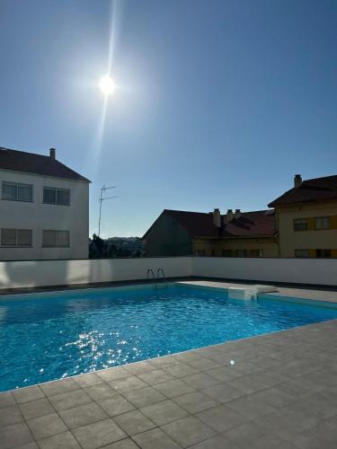 a swimming pool in the middle of a building at Apartamento "Playa de Sada" in Sada