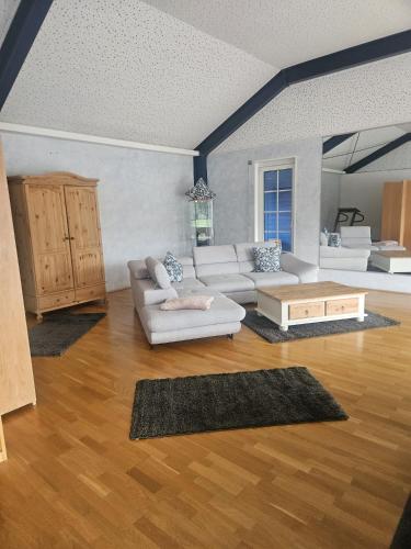 a living room with a couch and a table at Ferienhaus im Eggetal in Preußisch Oldendorf