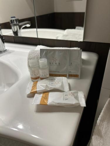 a bathroom sink with two bottles ofodorizers on it at Casa Cianetta in San Dorligo della Valle
