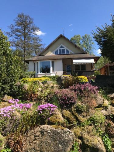 a house with flowers in front of it at Forest Paradise in Stružná