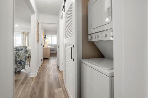 a kitchen with a washer and dryer in a room at 2 Bedroom Bayside Condo with Pool in OCMD in Ocean City