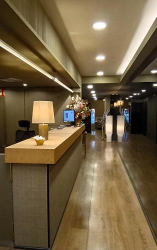 an office lobby with a reception counter with a desk at Senator Barcelona Apartments in Barcelona