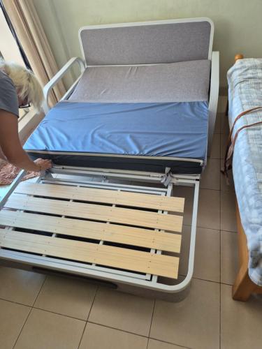 a hospital bed in a room with two beds at Casa Espana in Pattaya South