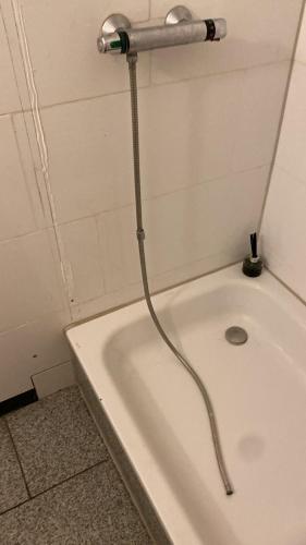 a shower in a bathroom with a bath tub at Bauernhof Privatzimmer Free WiFi Gemeinschaftsbad in Hausbreitenbach