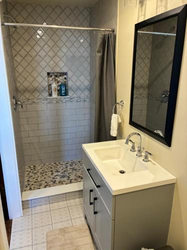 a bathroom with a sink and a shower at Alden Villa in Lebanon