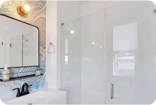 a bathroom with a sink and a mirror at Simply Adventurous in Mexico Beach