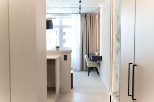 an office with a desk and a chair in a room at Designer Studio - Rooftop - Sea View - Arcadia 200m in Odesa