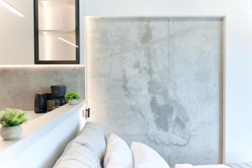 a living room with a couch and a glass window at Designer Studio - Rooftop - Sea View - Arcadia 200m in Odesa