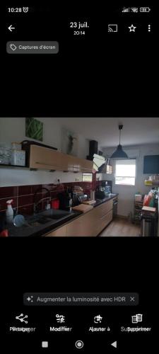 a screenshot of a kitchen with a picture of a kitchen at Eugénie86 in Poitiers