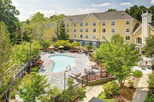 an aerial view of a hotel with a swimming pool at Homewood Suites by Hilton Raleigh/Cary in Cary