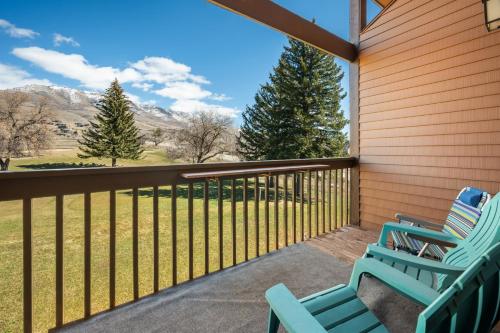 two chairs on a porch with mountains in the background at Sigi's Longhorn Lodge WL1409 Gym Ski Powder Mtn in Eden