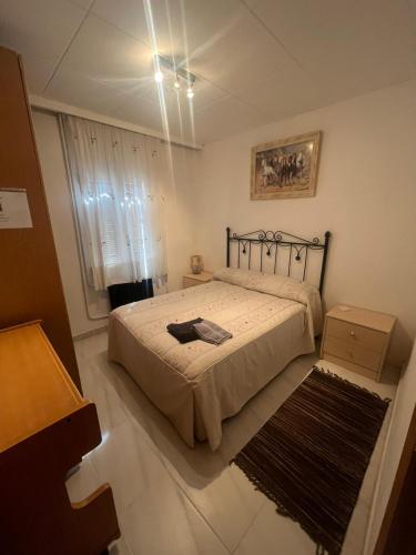 a bedroom with a bed and a rug at La Morada del Jucar in Cuenca