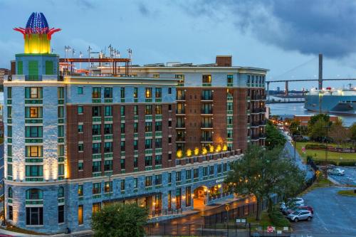 a large building with a tower on top of it at Homewood Suites Savannah Historic District/Riverfront in Savannah