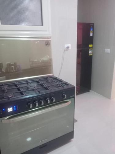 a stove top oven sitting in a kitchen at Luxor lights palace in Luxor
