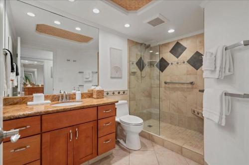 a bathroom with a toilet sink and a shower at Lahaina203 in Lahaina
